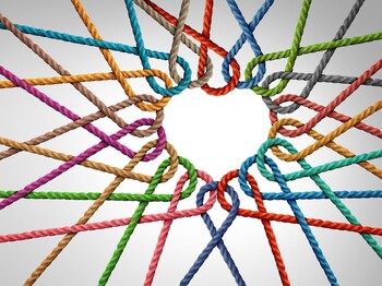 Unity and love partnership as ropes shaped as a heart in a group of diverse strings connected together shaped as a support symbol expressing the feeling of teamwork and togetherness. Unity,And,Love,Partnership,As,Ropes,Shaped,As,A,Heart