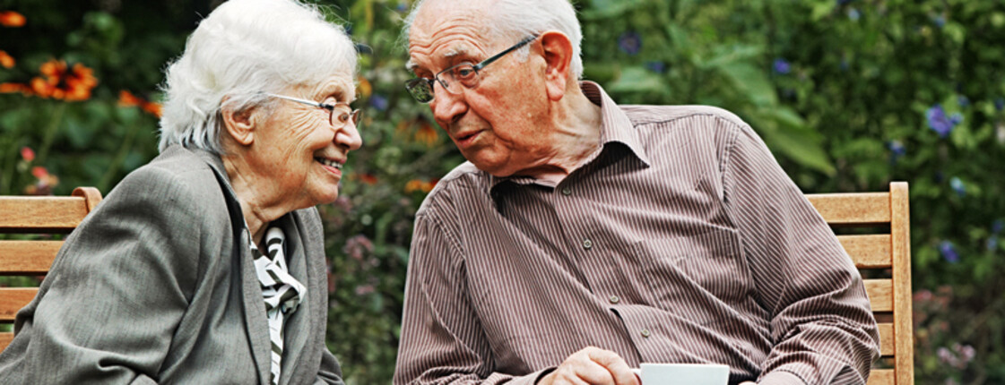 aged couple on the garden bench